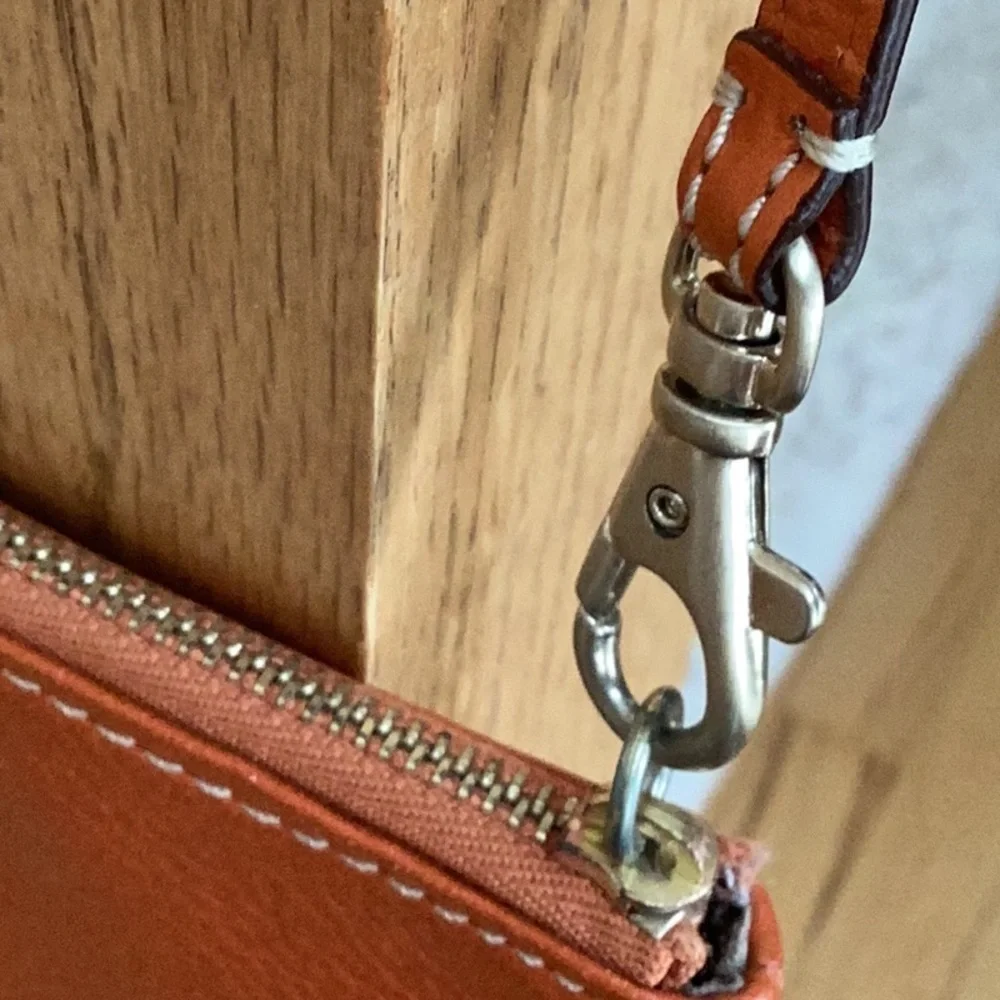Michael Kors orange, gold tone Studded wristlet, clutch, zipper pouch